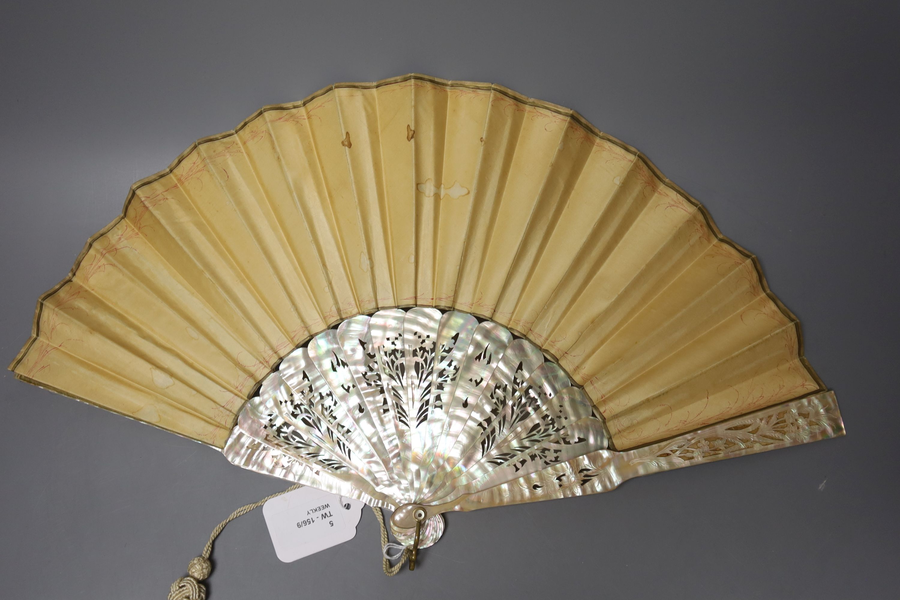 An ivory page turner with embossed white metal handle, a pair of opera glasses and three fans, various